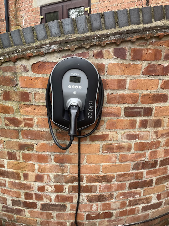 Zappi EV charger installed on external brickwork