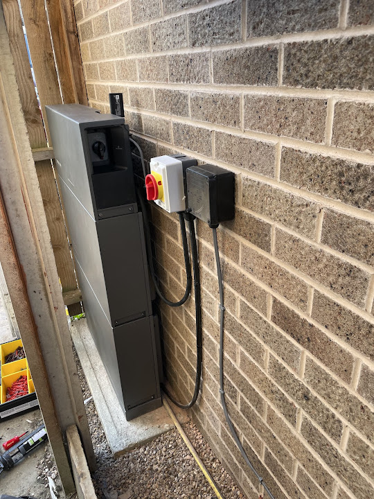 Slim EcoFlow battery and integrated inverter installed at a local property