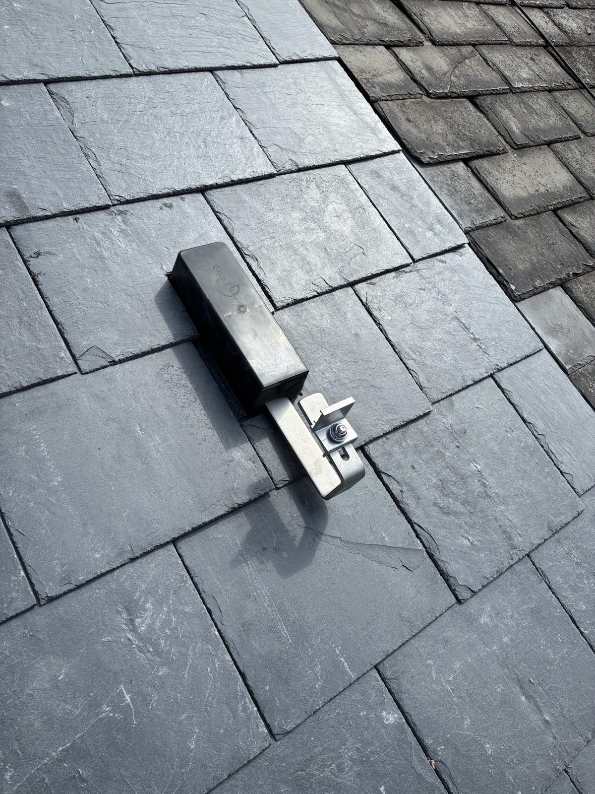 Genius slate flashing kit and solar mounting bracket on a slate roof